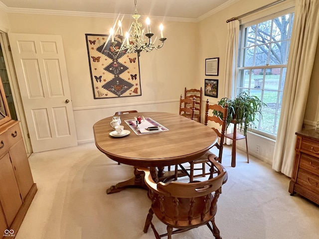 dining area with crown molding, light colored carpet, and a chandelier