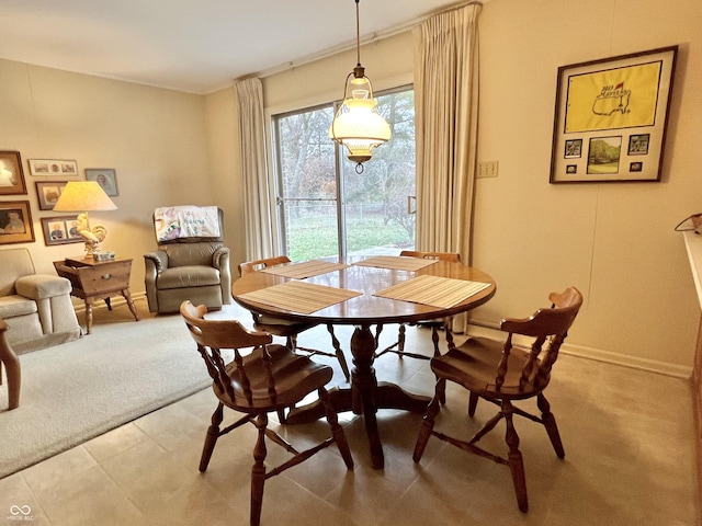 view of carpeted dining space