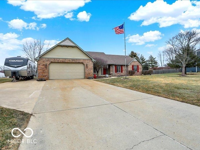 view of front of house with a garage and a front lawn