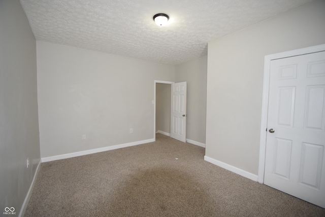 10 N Keystone Ave, Indianapolis, IN 46201 - carpeted empty room featuring a textured ceiling