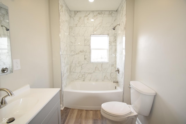 10 N Keystone Ave, Indianapolis, IN 46201 - full bathroom with vanity, tiled shower / bath combo, toilet, and hardwood / wood-style flooring