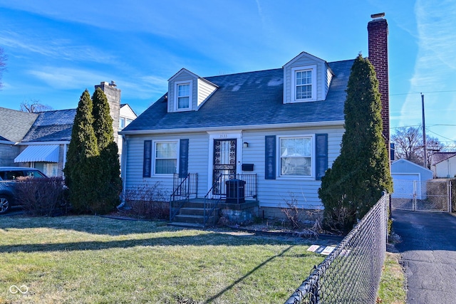 cape cod home with a garage, an outbuilding, a front yard, and central air condition unit