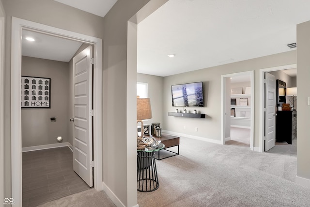 hallway featuring carpet floors