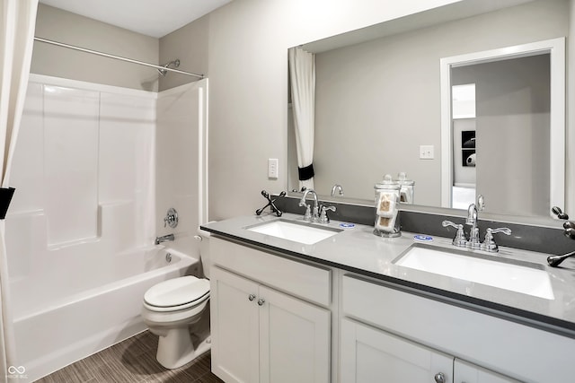 full bathroom with bathing tub / shower combination, vanity, and toilet