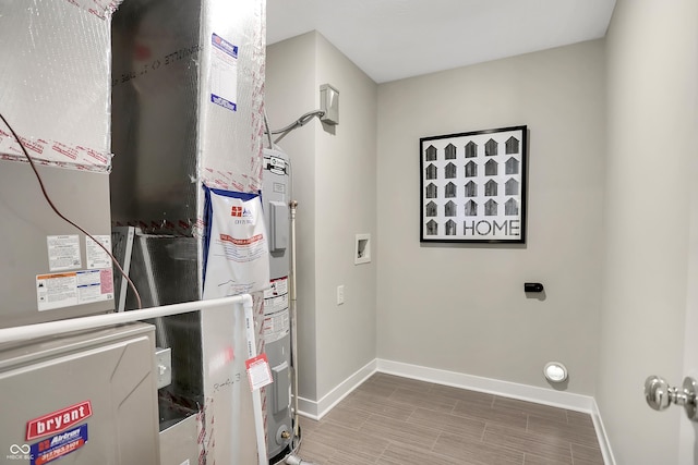 utility room featuring heating unit