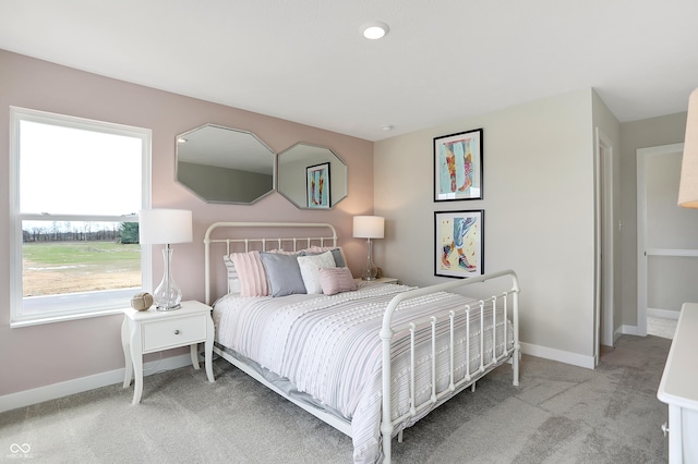 bedroom with light colored carpet