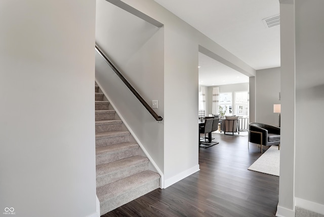 stairs with wood-type flooring