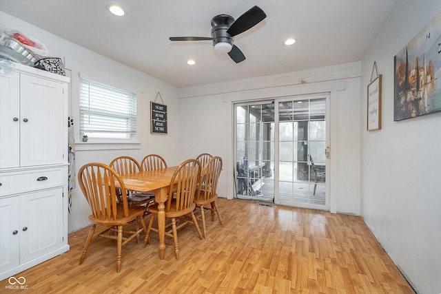 dining room with ceiling fan and light hardwood / wood-style flooring