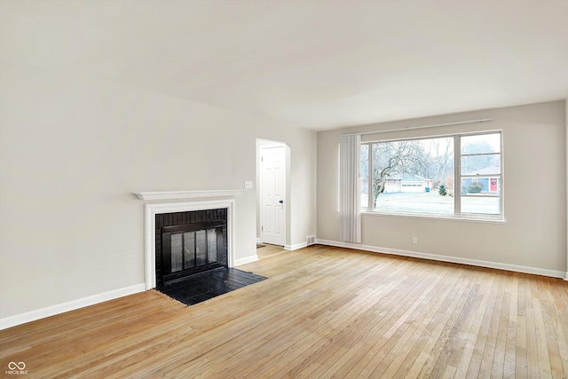 unfurnished living room featuring light hardwood / wood-style floors