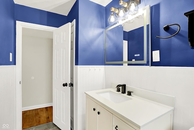 bathroom with vanity and hardwood / wood-style flooring