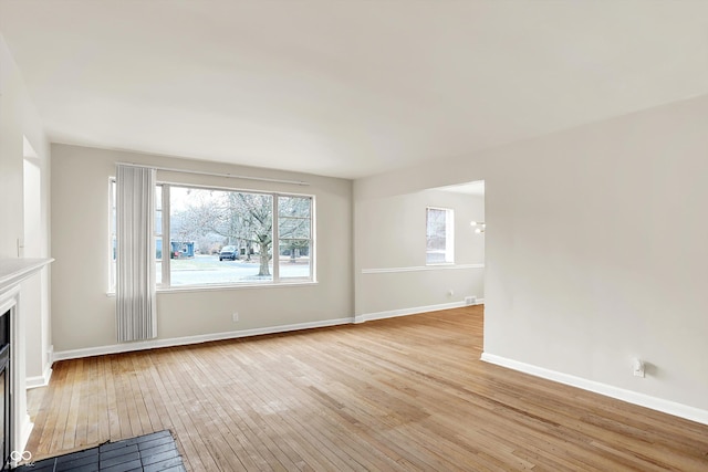 unfurnished living room with light hardwood / wood-style floors