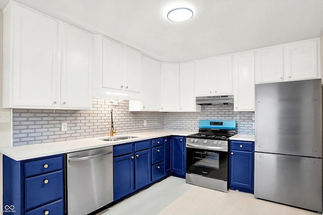 kitchen featuring blue cabinetry, sink, stainless steel appliances, decorative backsplash, and white cabinets