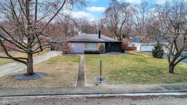 single story home with a front lawn