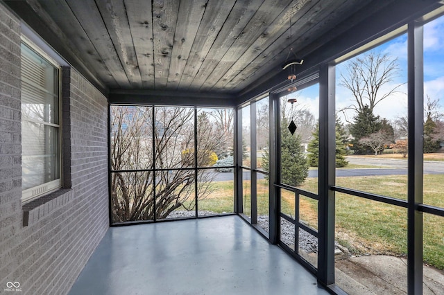 unfurnished sunroom featuring wooden ceiling