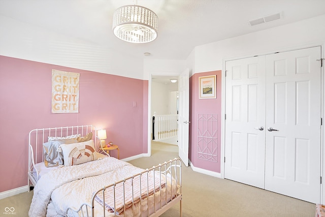 carpeted bedroom featuring a closet