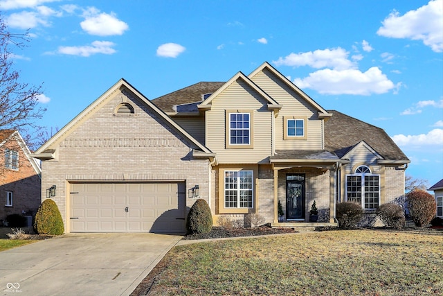 view of front of house featuring a garage and a front yard