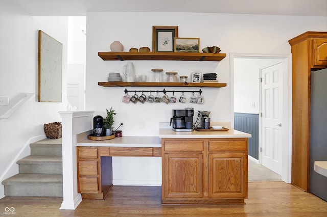 bar with hardwood / wood-style floors