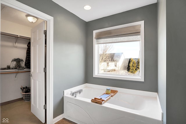 bathroom featuring a tub to relax in