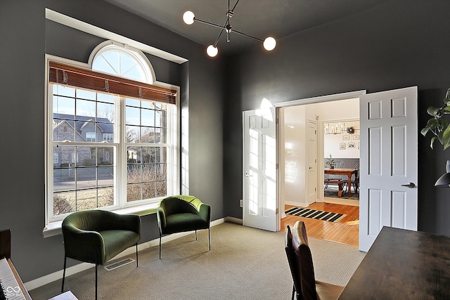 sitting room with hardwood / wood-style flooring