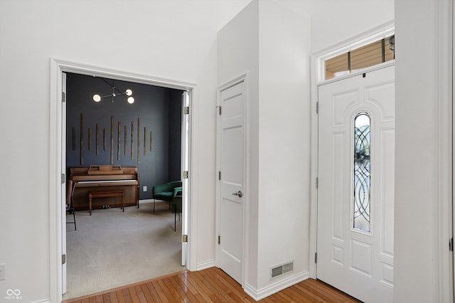 foyer with light hardwood / wood-style flooring