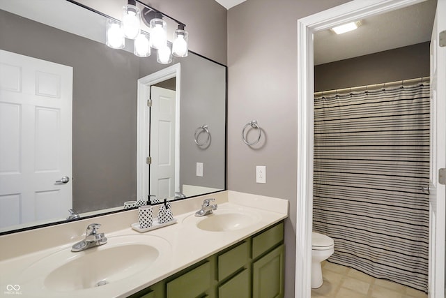 bathroom featuring vanity, a shower with shower curtain, and toilet