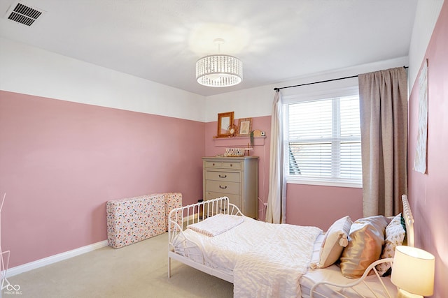 bedroom featuring light carpet