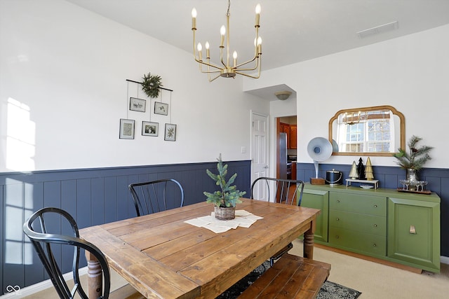 dining area featuring an inviting chandelier