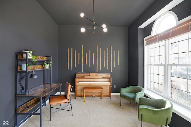 sitting room featuring carpet floors and a notable chandelier