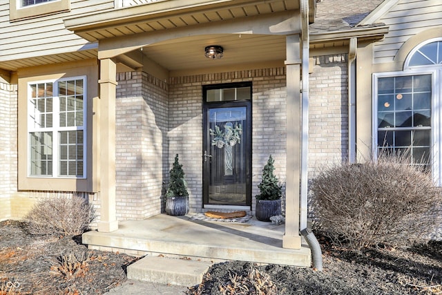 doorway to property featuring covered porch