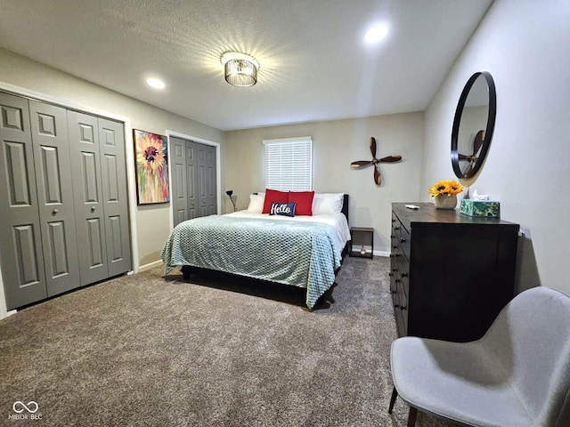 carpeted bedroom with multiple closets