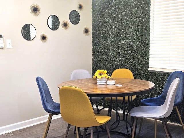 dining room with hardwood / wood-style floors