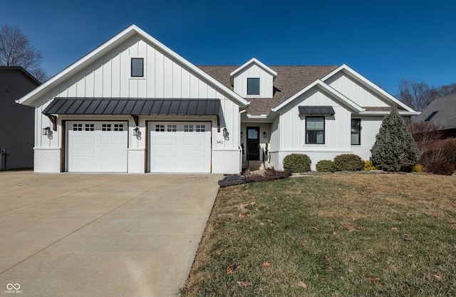 modern farmhouse style home with a garage and a front yard