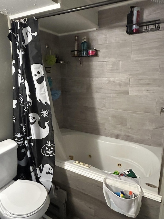 bathroom with shower / tub combo and toilet