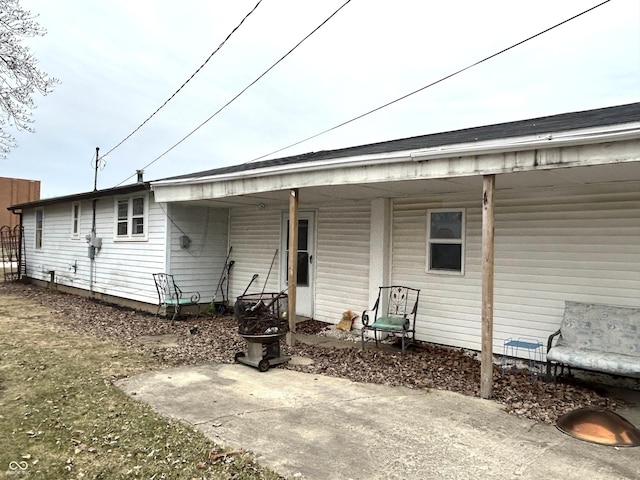 rear view of property featuring a patio area