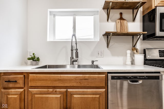 kitchen with appliances with stainless steel finishes and sink