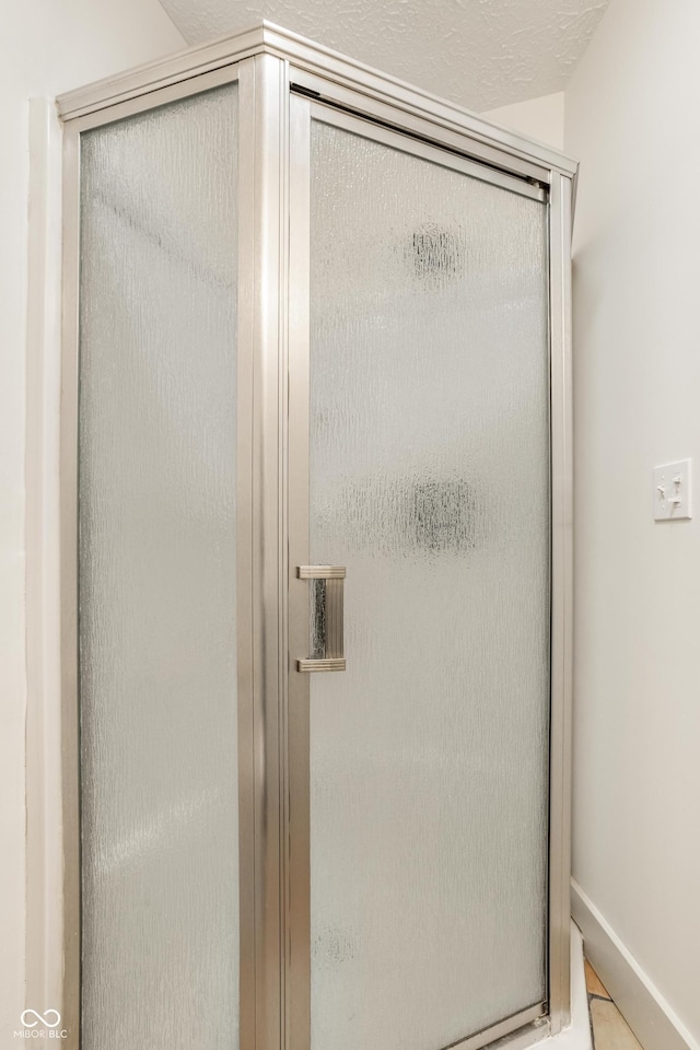 bathroom with an enclosed shower