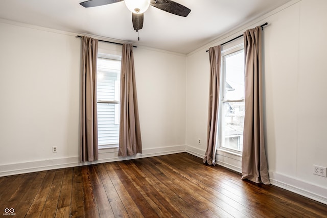 spare room featuring dark hardwood / wood-style floors, a wealth of natural light, and ceiling fan