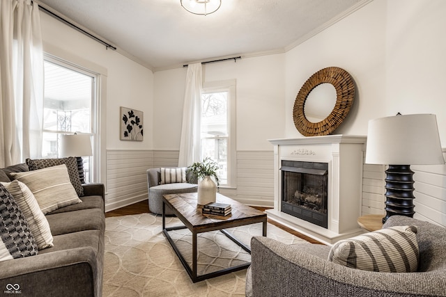 living room featuring ornamental molding and light wood-type flooring