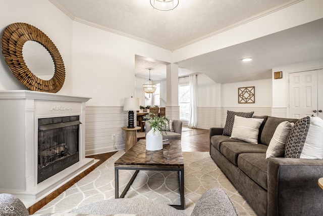 living room with wood-type flooring and crown molding