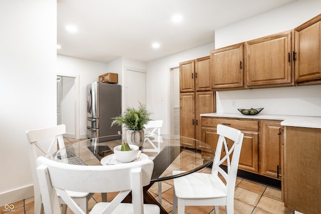 dining space with light tile patterned floors