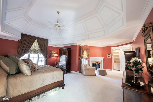 carpeted bedroom featuring baseboards, ornamental molding, coffered ceiling, and a high end fireplace