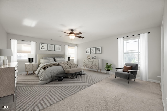 carpeted bedroom with a ceiling fan and baseboards