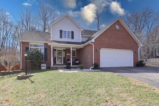 traditional-style home with brick siding, a front lawn, aphalt driveway, a porch, and a garage