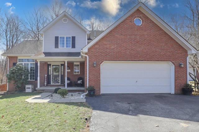 traditional home with roof with shingles, driveway, a porch, a front lawn, and brick siding