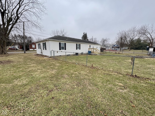 view of side of home featuring a lawn