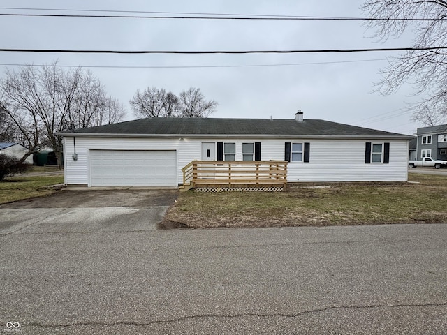 view of front of property with a garage and a deck