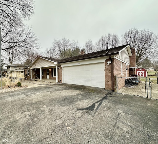 view of front of home featuring a garage and covered porch