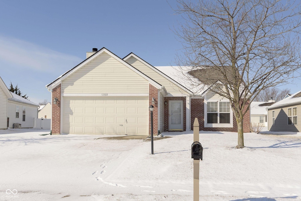 ranch-style house featuring a garage