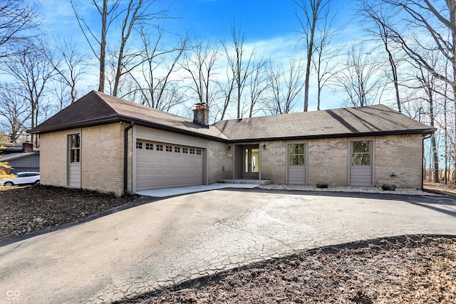 single story home featuring a garage