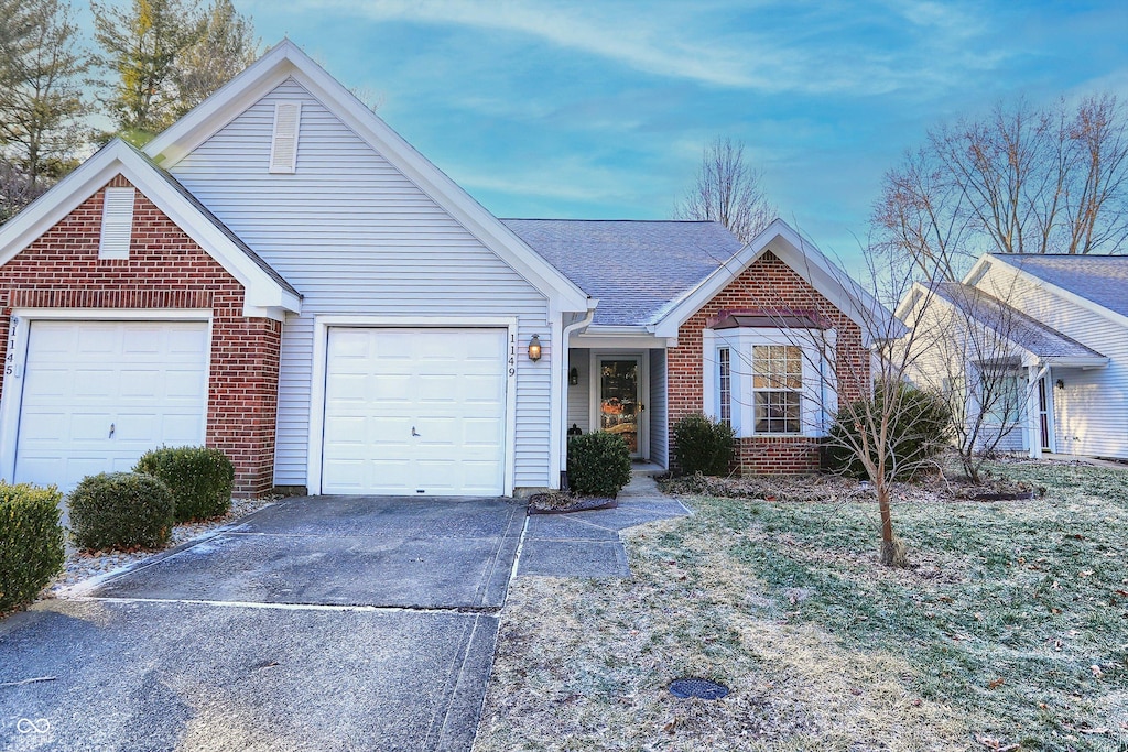 single story home featuring a garage